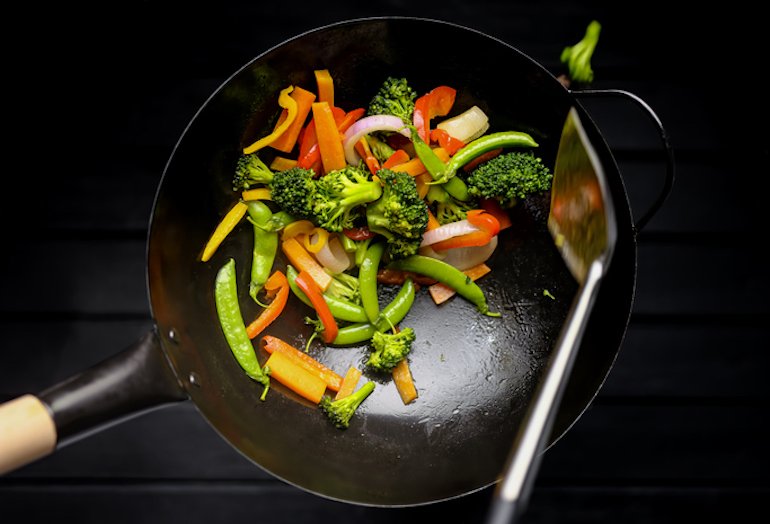 Cooking foods rich in vitamin C, including broccoli and bell peppers, to boost collagen production through diet